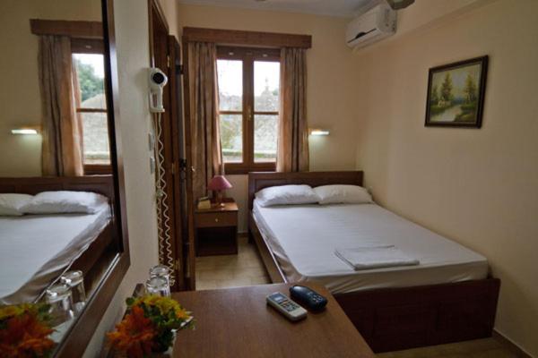 Postel nebo postele na pokoji v ubytování Mango Rooms