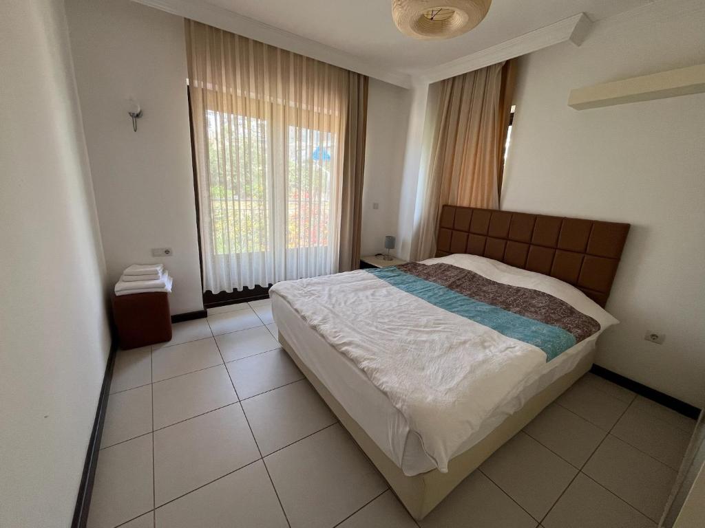 Postel nebo postele na pokoji v ubytování Derya Beach Apartment
