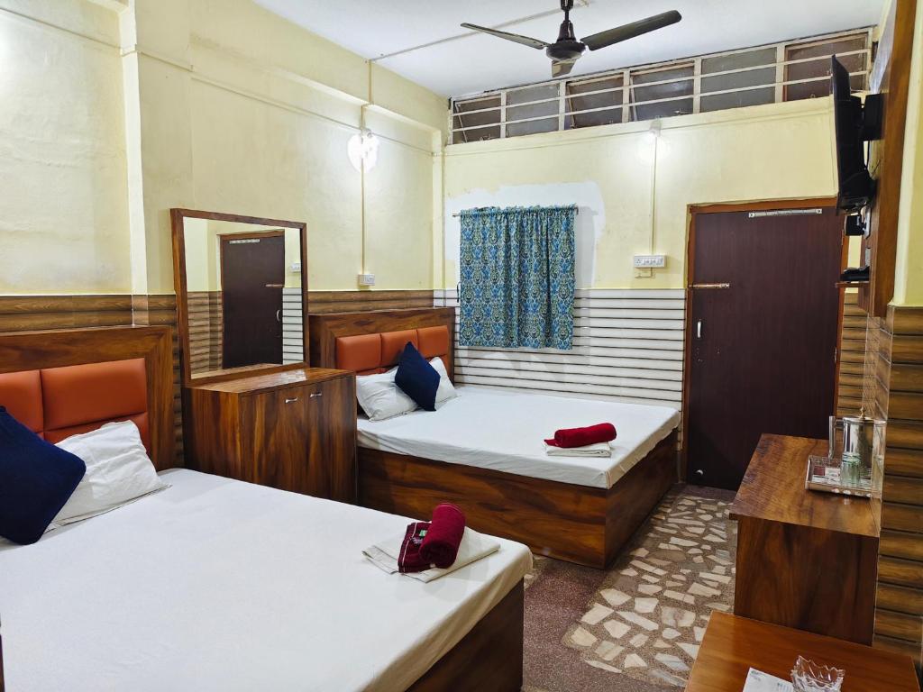 Postel nebo postele na pokoji v ubytování Hotel Raj
