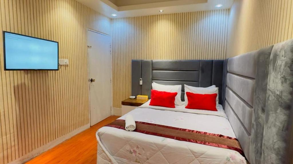 Postel nebo postele na pokoji v ubytování Rezala Sweet Home Uttara