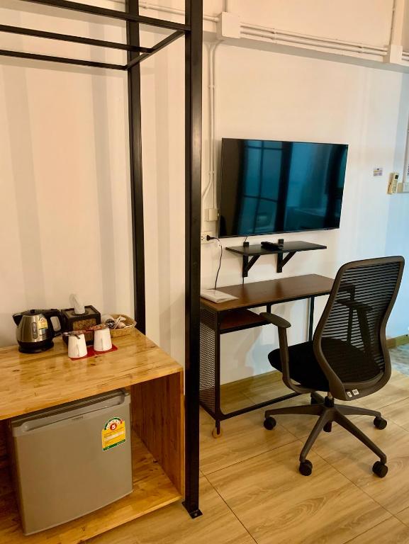 TV a/nebo společenská místnost v ubytování Kailub Rooms Hotel