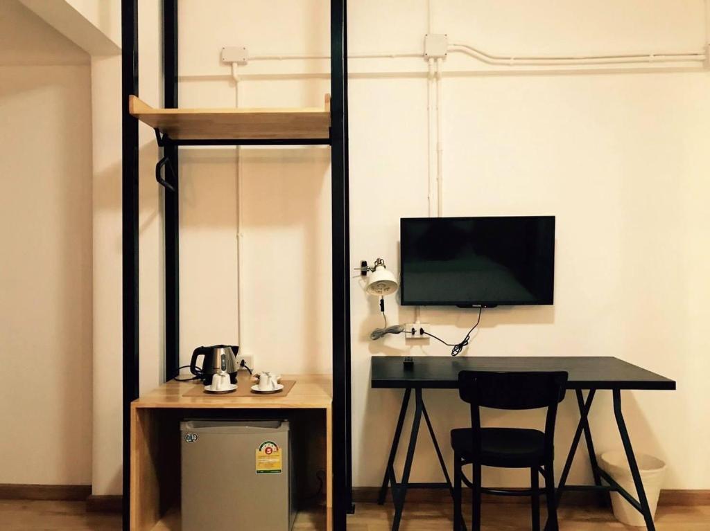 TV a/nebo společenská místnost v ubytování Kailub Rooms Hotel