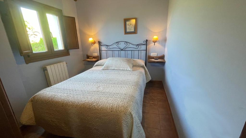 Ένα ή περισσότερα κρεβάτια σε δωμάτιο στο Casa El Collau I