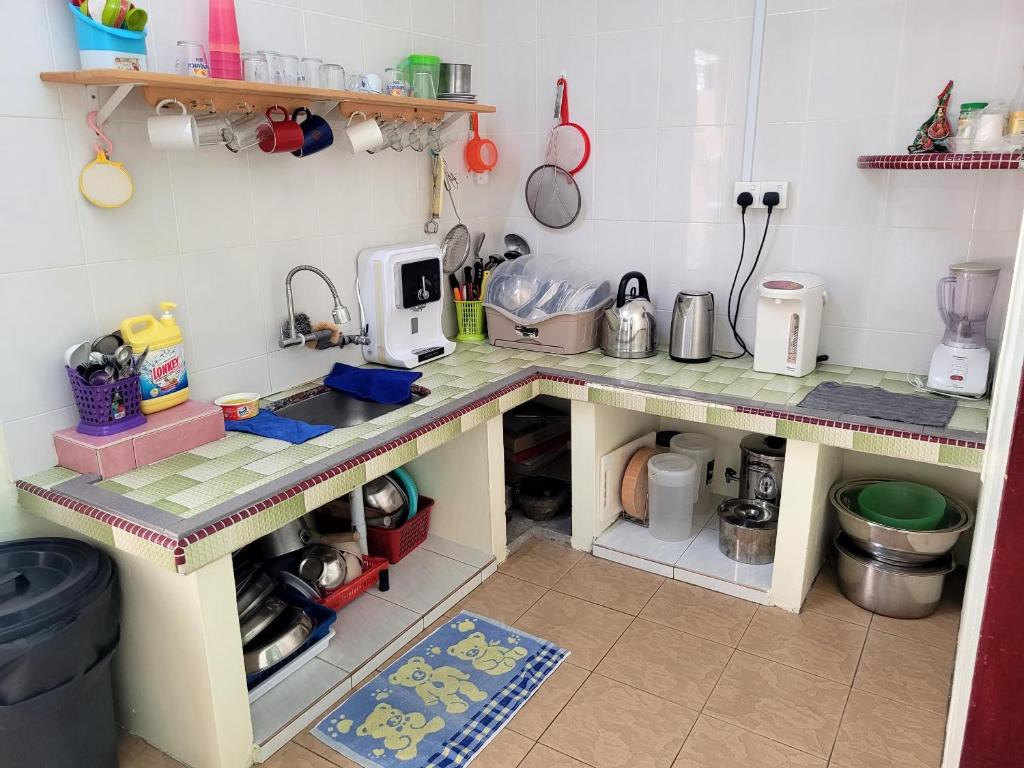 Kuchyň nebo kuchyňský kout v ubytování Pangkor Homestay