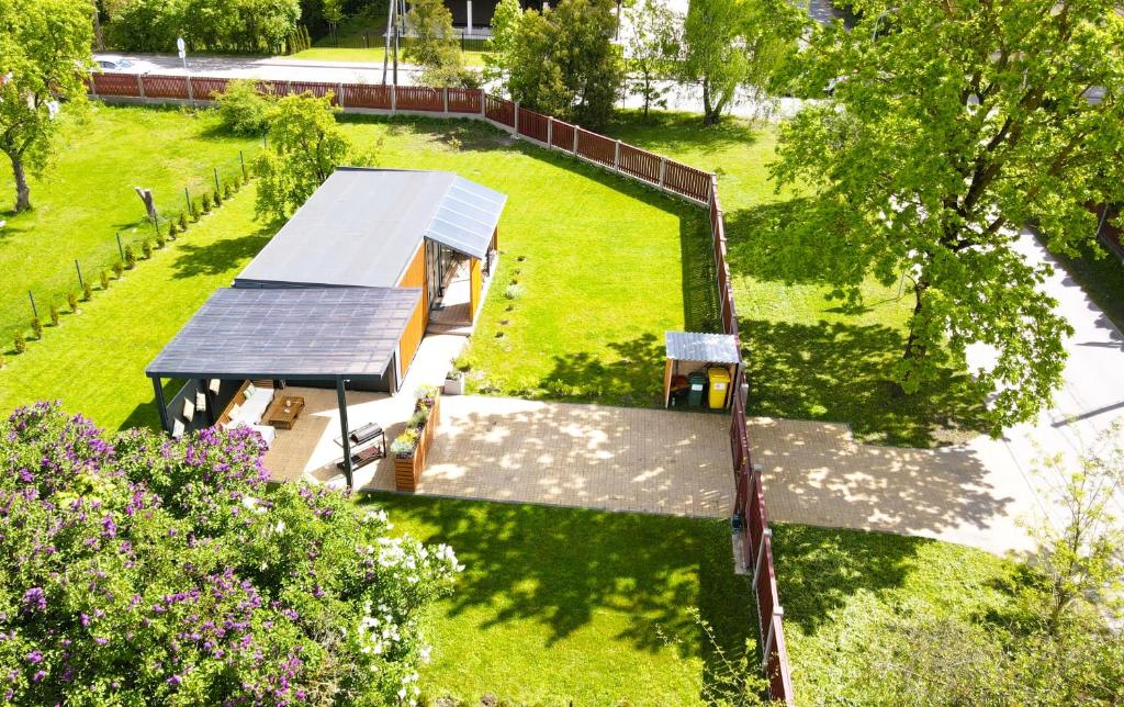 an overhead view of a park with a picnic shelter at House - Linini in Mārupe