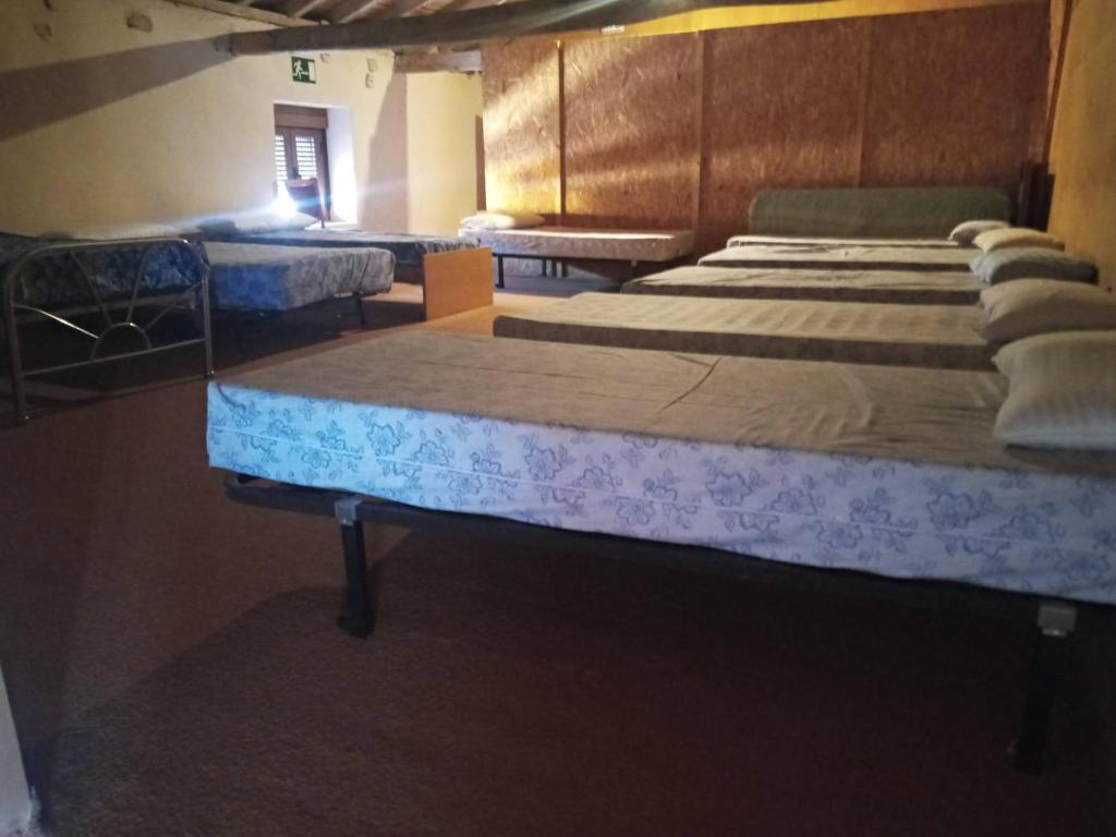 Postel nebo postele na pokoji v ubytování Albergue El Palomar