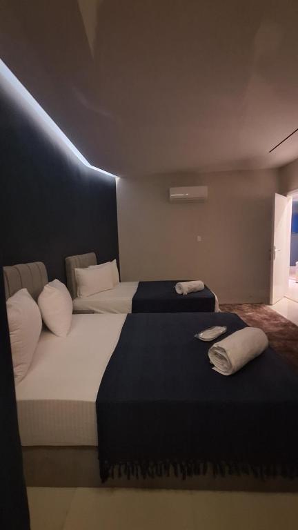 Postel nebo postele na pokoji v ubytování downtown Family Suites