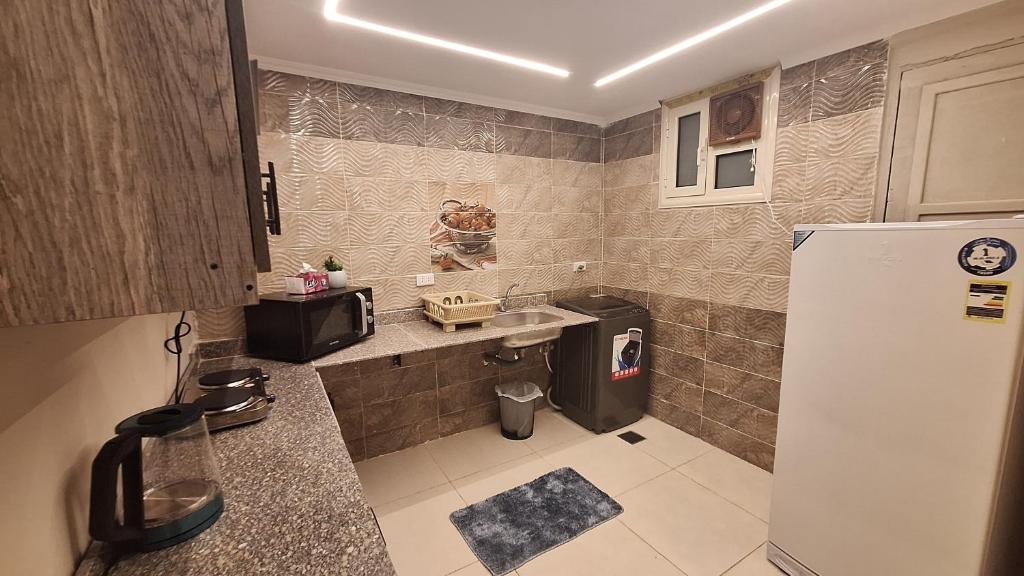 Kuchyň nebo kuchyňský kout v ubytování downtown Family Suites