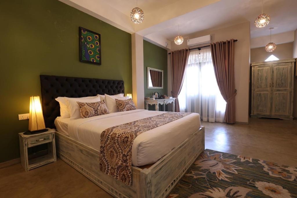 Postel nebo postele na pokoji v ubytování Earthbound Residence