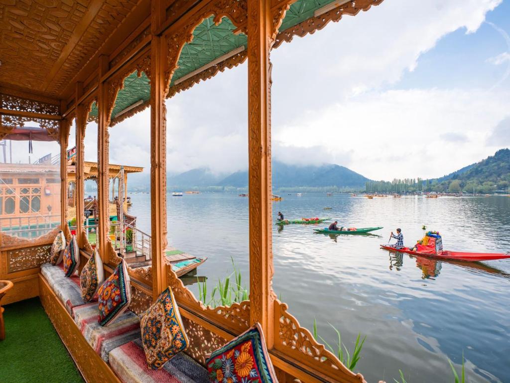 a group of people in boats on the water at Moustache Houseboat Srinagar in Srinagar