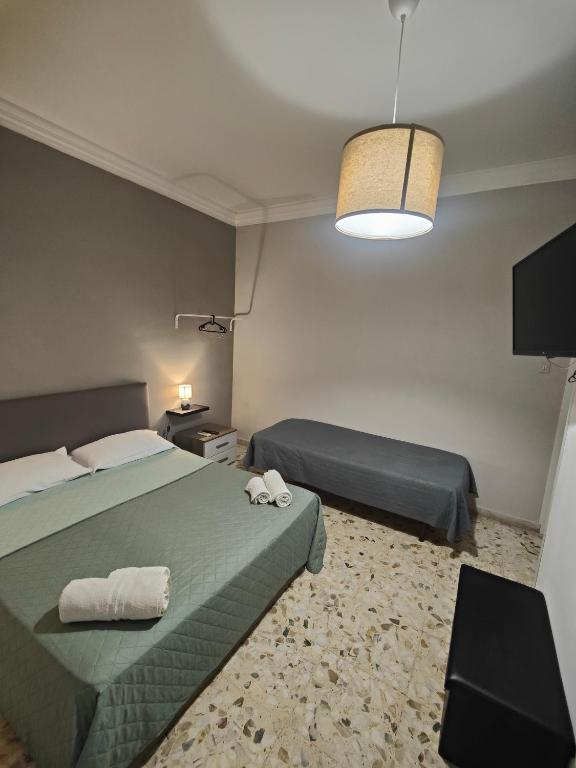 Łóżko lub łóżka w pokoju w obiekcie Etnea Gioeni House Suite