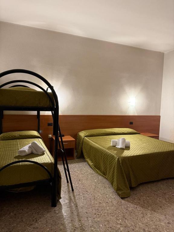 Postel nebo postele na pokoji v ubytování Hotel Villa Giusy