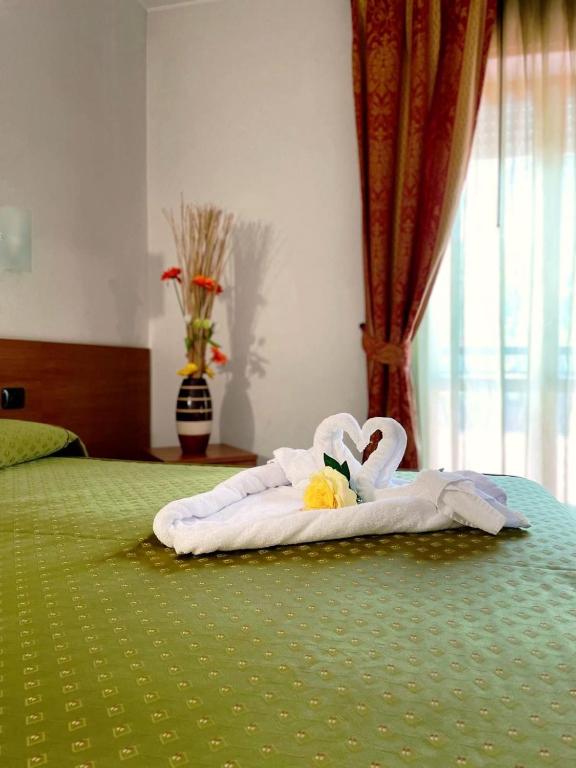 Postel nebo postele na pokoji v ubytování Hotel Villa Giusy