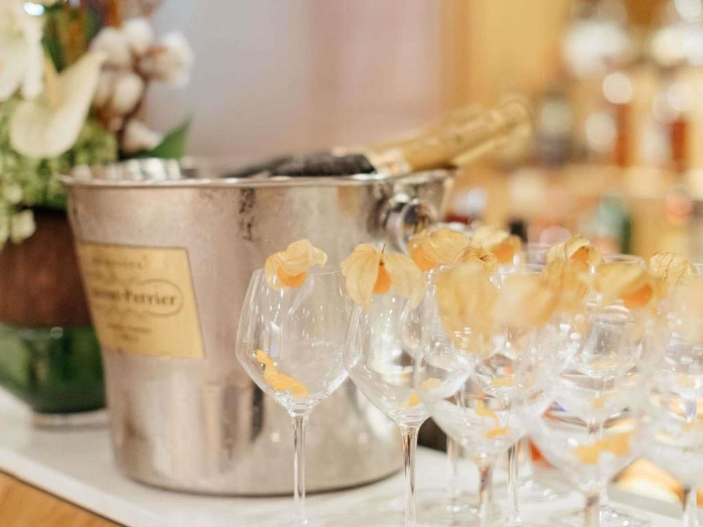 a group of wine glasses sitting on a counter at Croisette Beach Hotel Cannes - MGallery Collection in Cannes