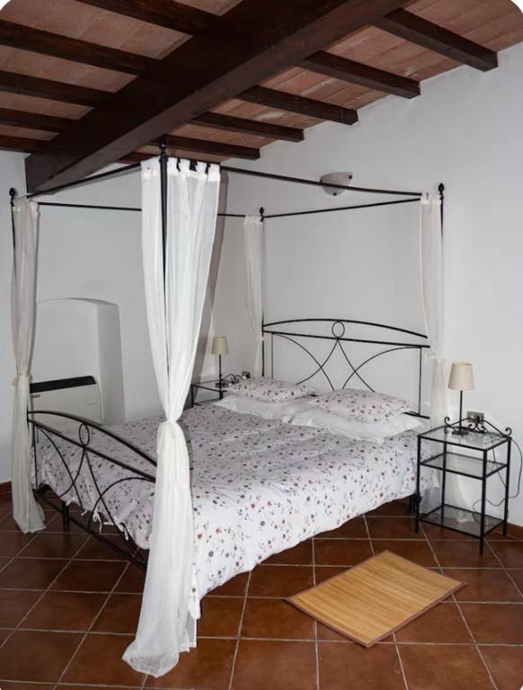 Postel nebo postele na pokoji v ubytování Agriturismo Podere Forano