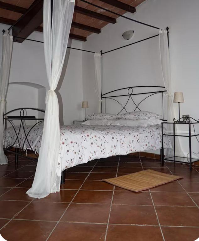 Postel nebo postele na pokoji v ubytování Agriturismo Podere Forano