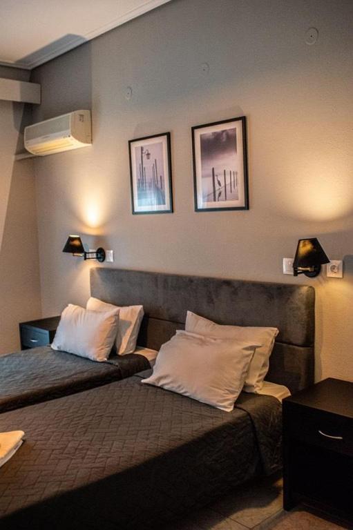 Postel nebo postele na pokoji v ubytování Hotel Kalloni