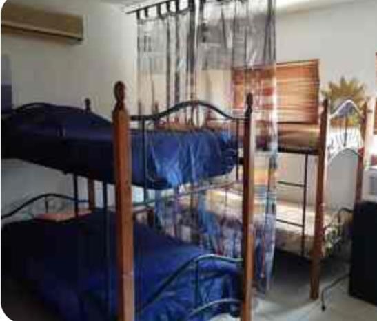 Postel nebo postele na pokoji v ubytování Palmitas Hostel
