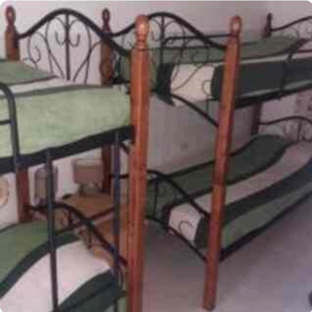 Postel nebo postele na pokoji v ubytování Palmitas Hostel