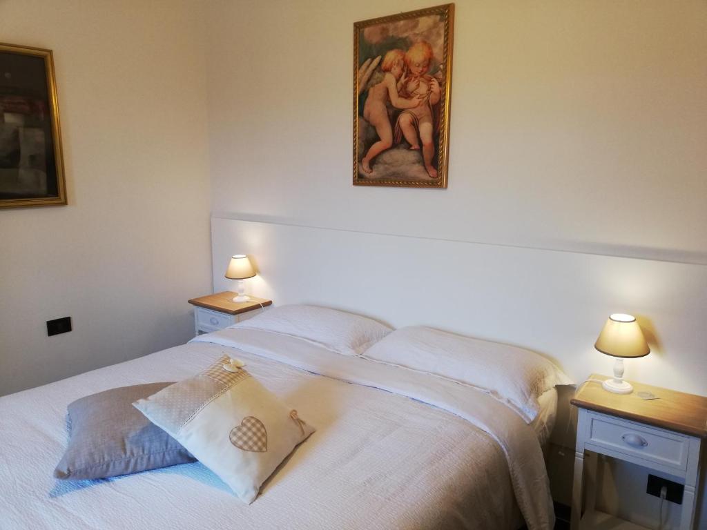 Postel nebo postele na pokoji v ubytování La Foresteria dei Baldi