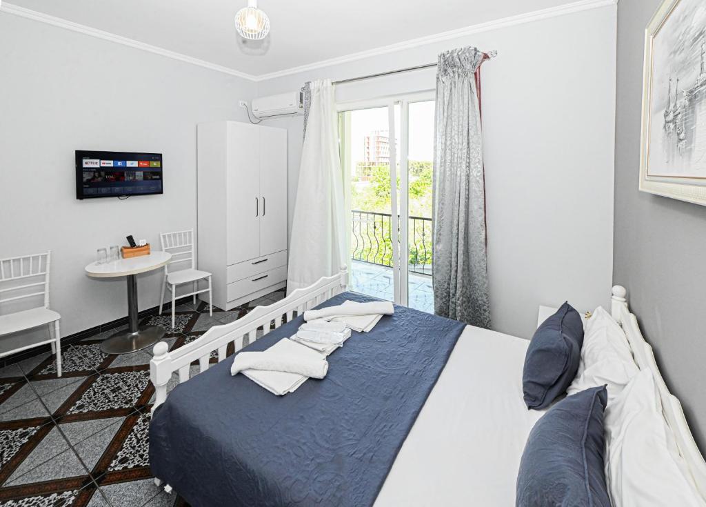Postel nebo postele na pokoji v ubytování Hotel Fama