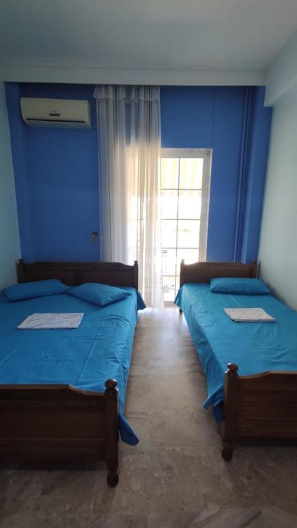 Postel nebo postele na pokoji v ubytování Ainalis Apartments