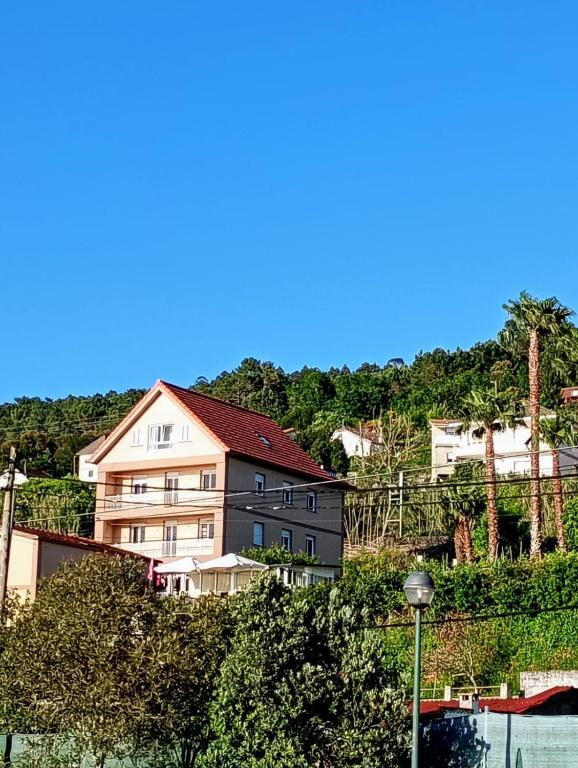 a group of houses on top of a hill at Pensión O Regato in Redondela