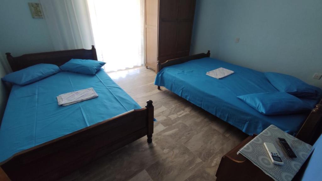 Postel nebo postele na pokoji v ubytování Ainalis Apartments