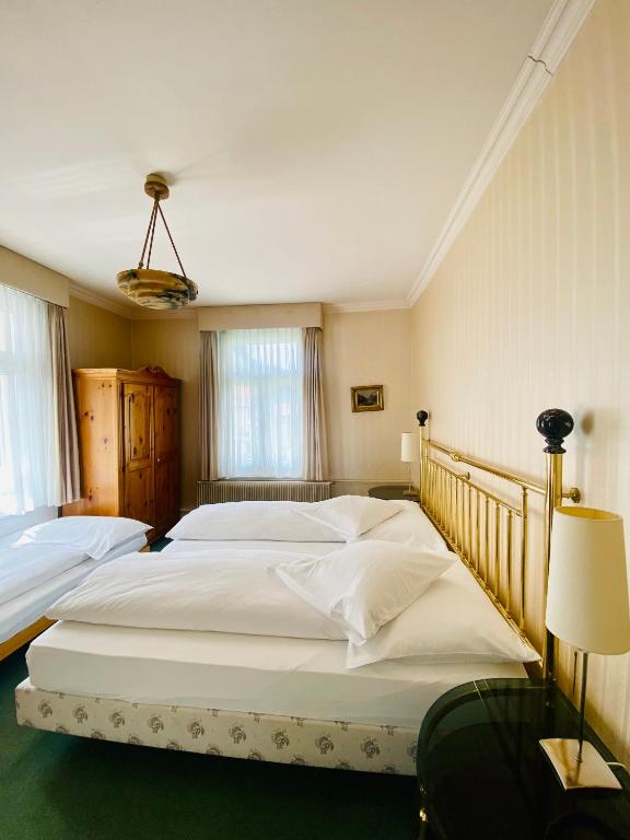 Postel nebo postele na pokoji v ubytování Hotel De La Paix