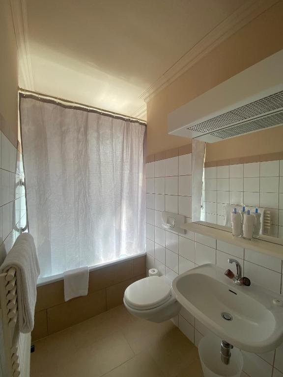 Koupelna v ubytování Hotel De La Paix