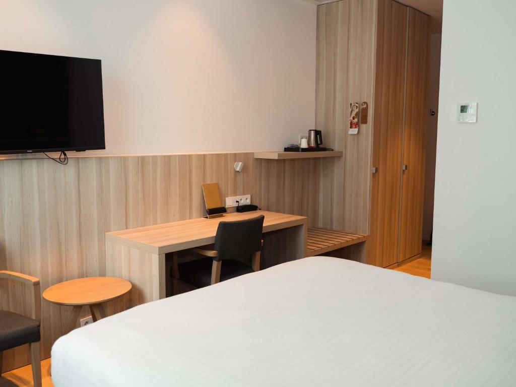 Postel nebo postele na pokoji v ubytování Mercure Roeselare