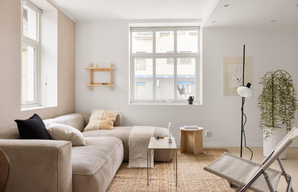 a living room with a couch and a table at Sentral leilighet, Bergen in Bergen