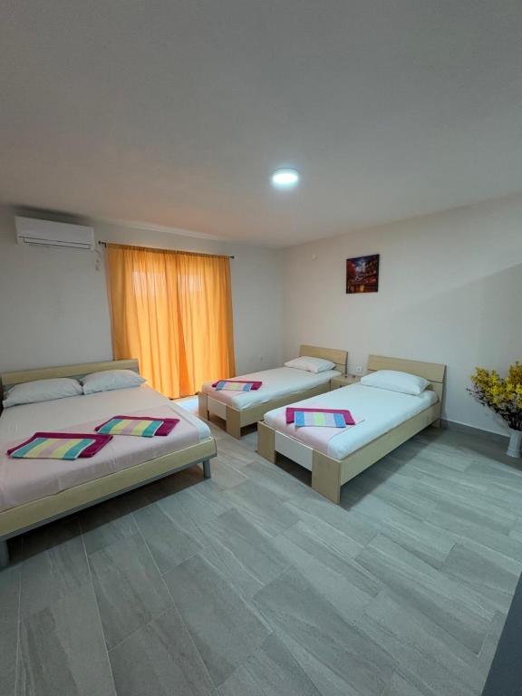 Postel nebo postele na pokoji v ubytování Apartmani Neum