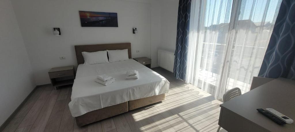 Postel nebo postele na pokoji v ubytování Vila Ame Eforie Nord