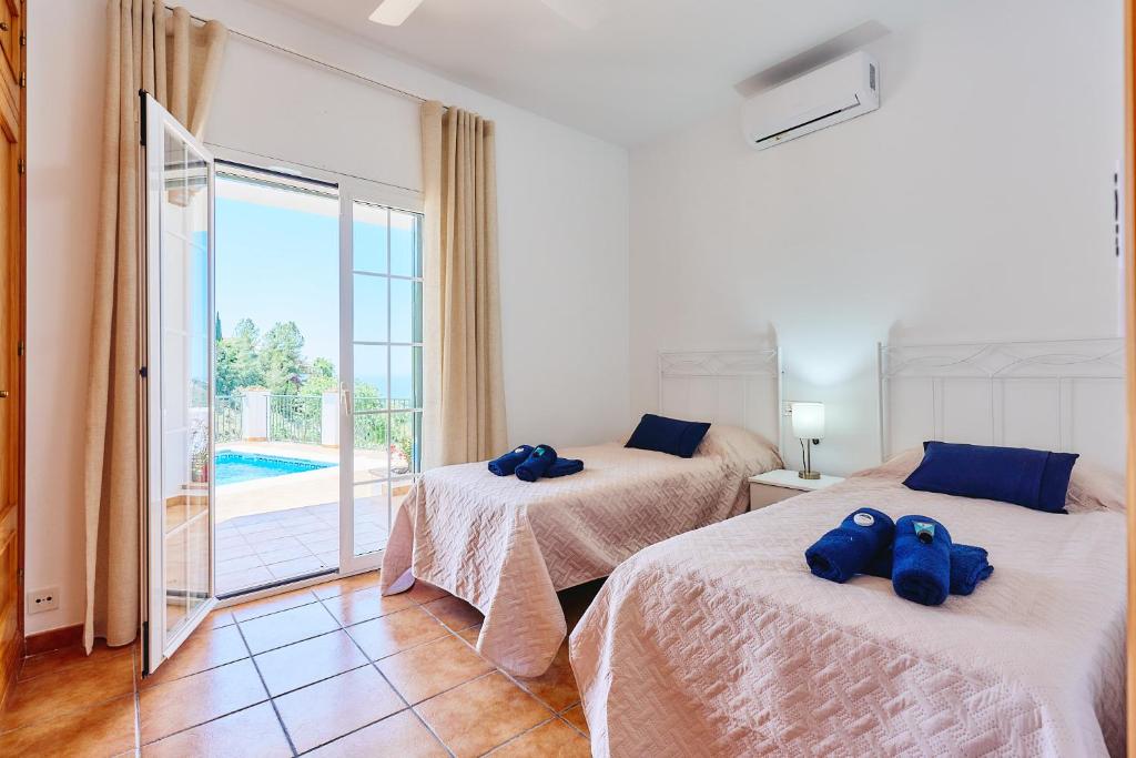 Ένα ή περισσότερα κρεβάτια σε δωμάτιο στο JA01 Villa Tomasina by HolidayAndaluz