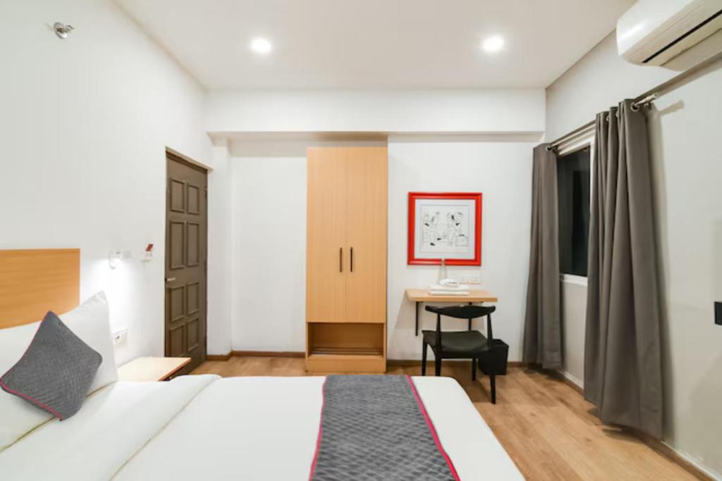 Postel nebo postele na pokoji v ubytování FabHotel Sayeeda International - 600m from Park Circus 7 Point