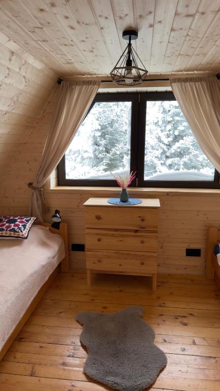 Posteľ alebo postele v izbe v ubytovaní Mountain Cottage Lubomierz
