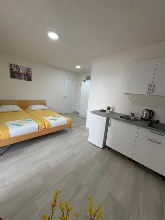 Kuchyň nebo kuchyňský kout v ubytování Apartmani Neum