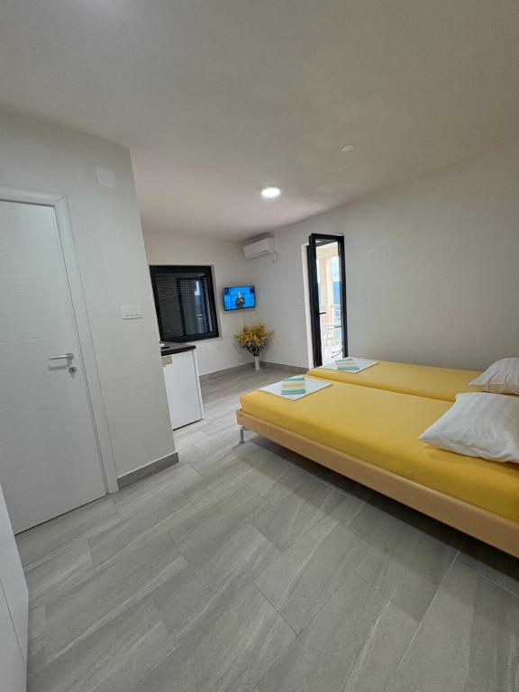 Postel nebo postele na pokoji v ubytování Apartmani Neum