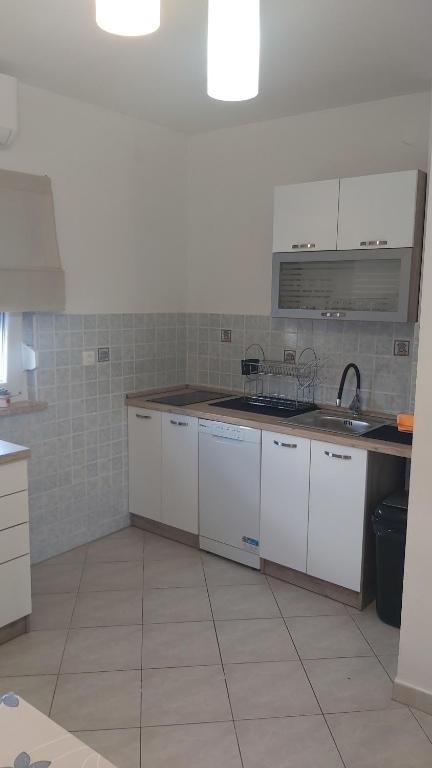Kuchyň nebo kuchyňský kout v ubytování Apartment Lara