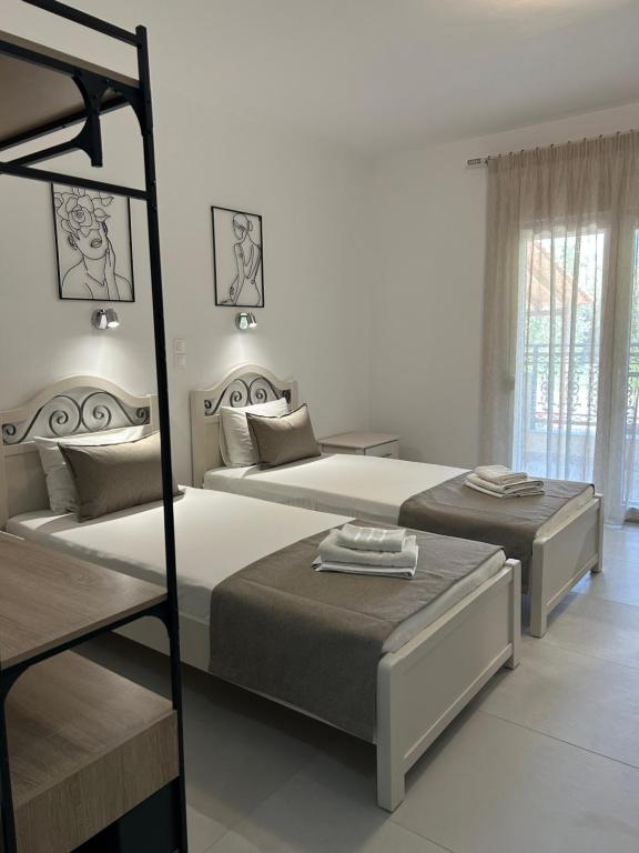 Postel nebo postele na pokoji v ubytování Iraklis Hotel