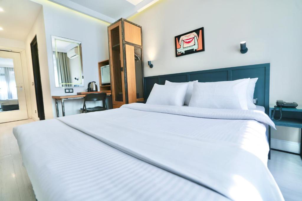 Postel nebo postele na pokoji v ubytování Fitas Oda Hotel