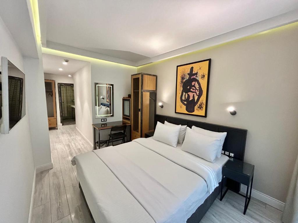 Postel nebo postele na pokoji v ubytování Fitas Oda Hotel