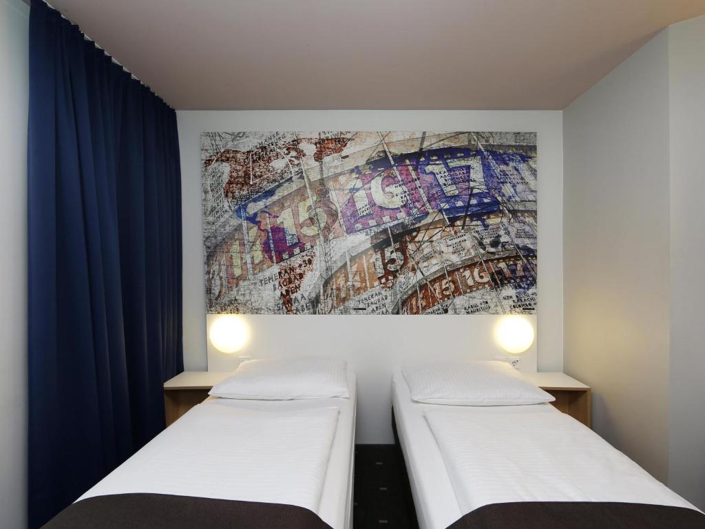 Postel nebo postele na pokoji v ubytování B&B HOTEL Berlin-Alexanderplatz