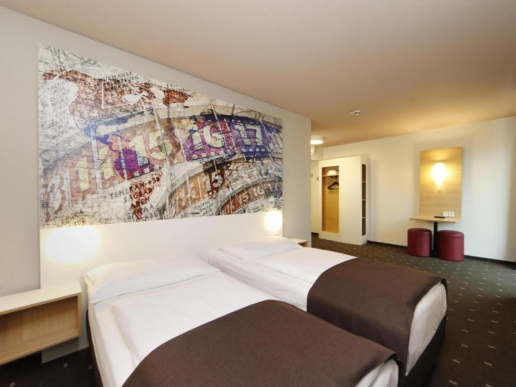 Postel nebo postele na pokoji v ubytování B&B HOTEL Berlin-Alexanderplatz