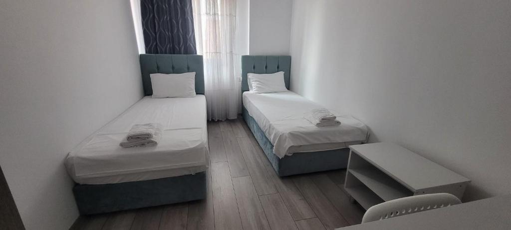 Postel nebo postele na pokoji v ubytování Vila Ame Eforie Nord