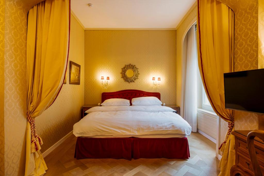 Vuode tai vuoteita majoituspaikassa Hotel Europe