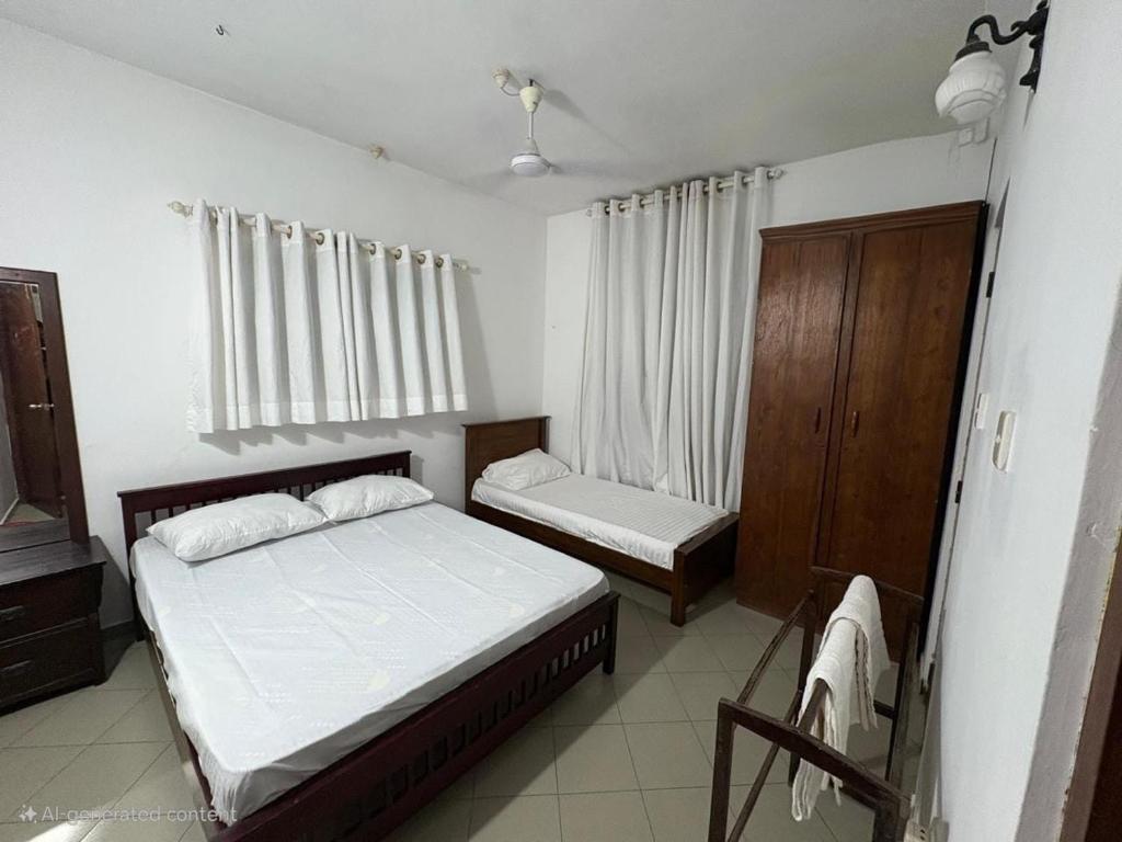 Ένα ή περισσότερα κρεβάτια σε δωμάτιο στο Sunset Apartment