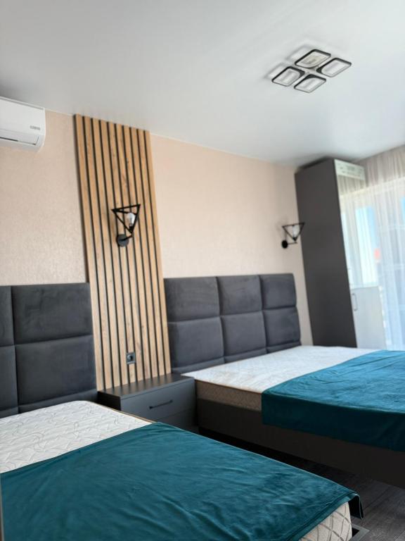 Postel nebo postele na pokoji v ubytování VIP HOTEL ZATOKA