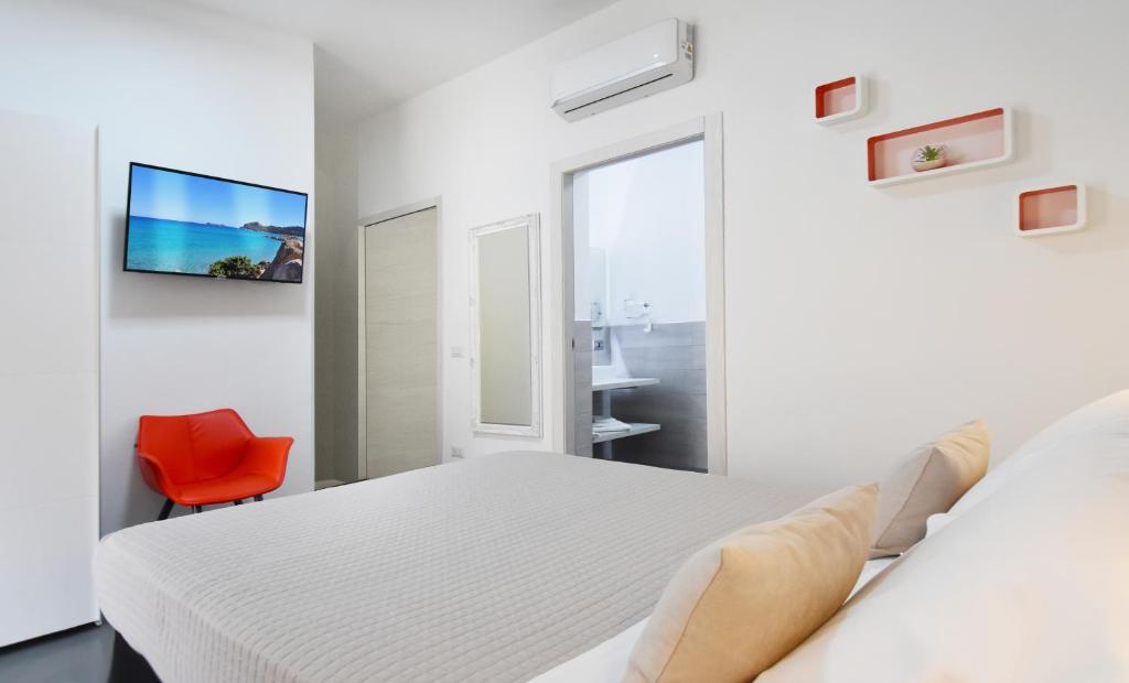 Postel nebo postele na pokoji v ubytování Elis b&b Villasimius